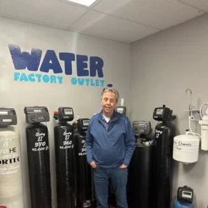 Man standing in front of Water Softeners